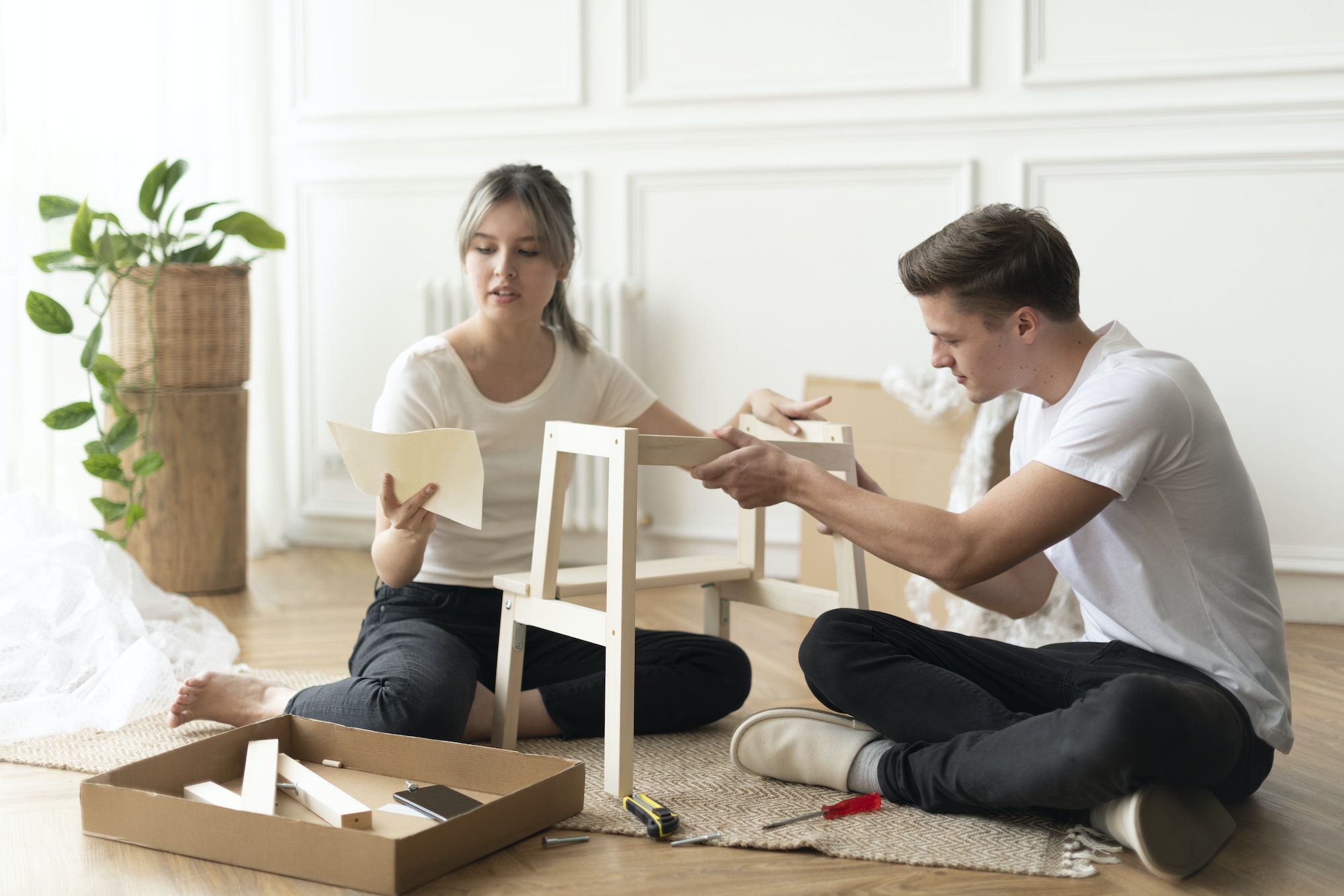 Couple assembling a diy chair from scratch